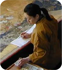 Artist sketching at a desk